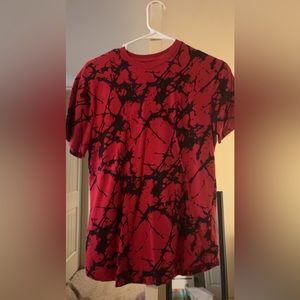 Red and Black speckled T-shirt. Size small
